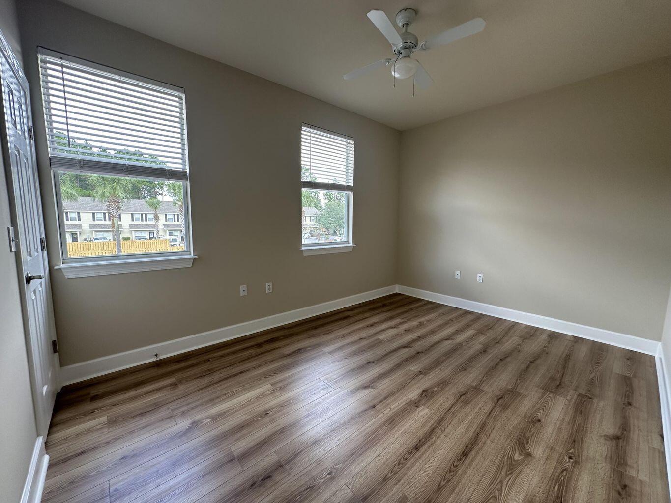 15284 331 Business, Unit 13B Freeport, FL 32439 - Photo 8 of 9 an empty room with wooden floor and windows