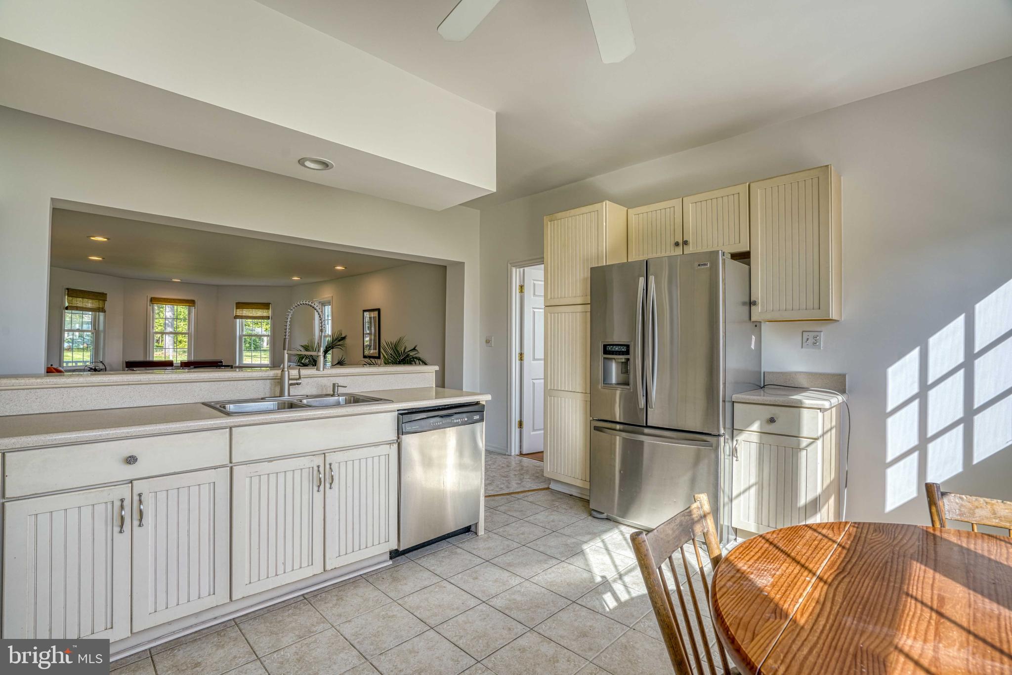 6403 Bozman Neavitt Road Neavitt, MD 21652 - Photo 11 of 31 a kitchen with stainless steel appliances granite countertop a refrigerator and a sink