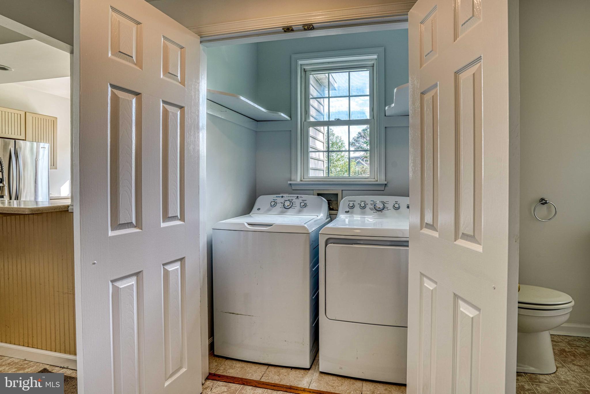 6403 Bozman Neavitt Road Neavitt, MD 21652 - Photo 16 of 31 a utility room with dryer and washer