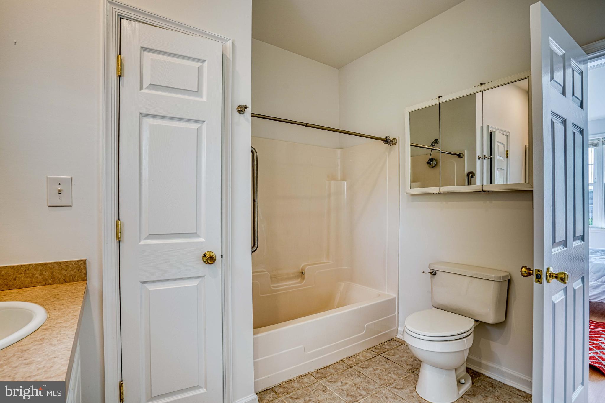 6403 Bozman Neavitt Road Neavitt, MD 21652 - Photo 17 of 31 a bathroom with a toilet and a bathtub