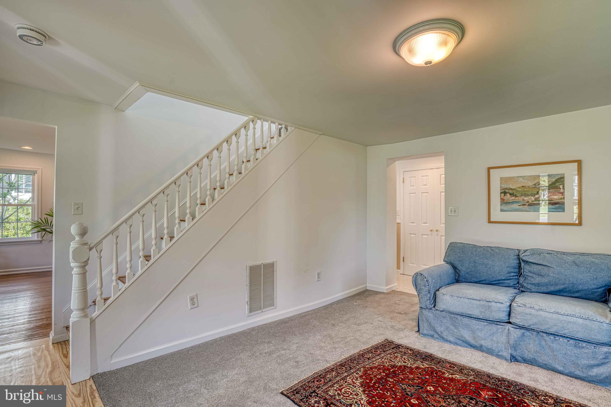6403 Bozman Neavitt Road Neavitt, MD 21652 - Photo 19 of 31 a living room with furniture and stairs