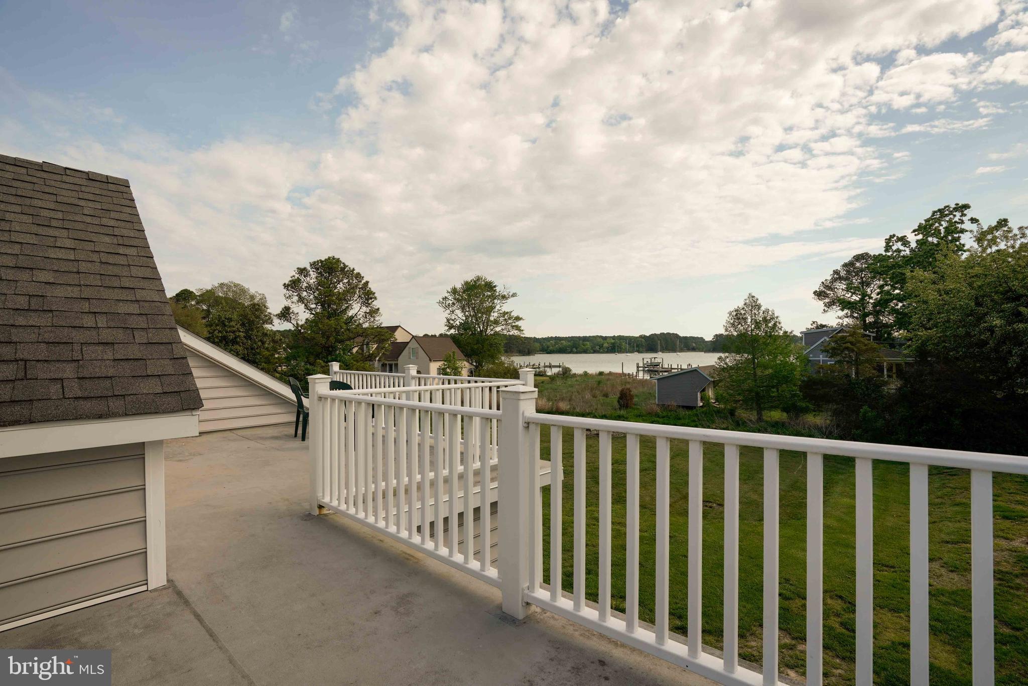 6403 Bozman Neavitt Road Neavitt, MD 21652 - Photo 25 of 31 a balcony with trees in front of it