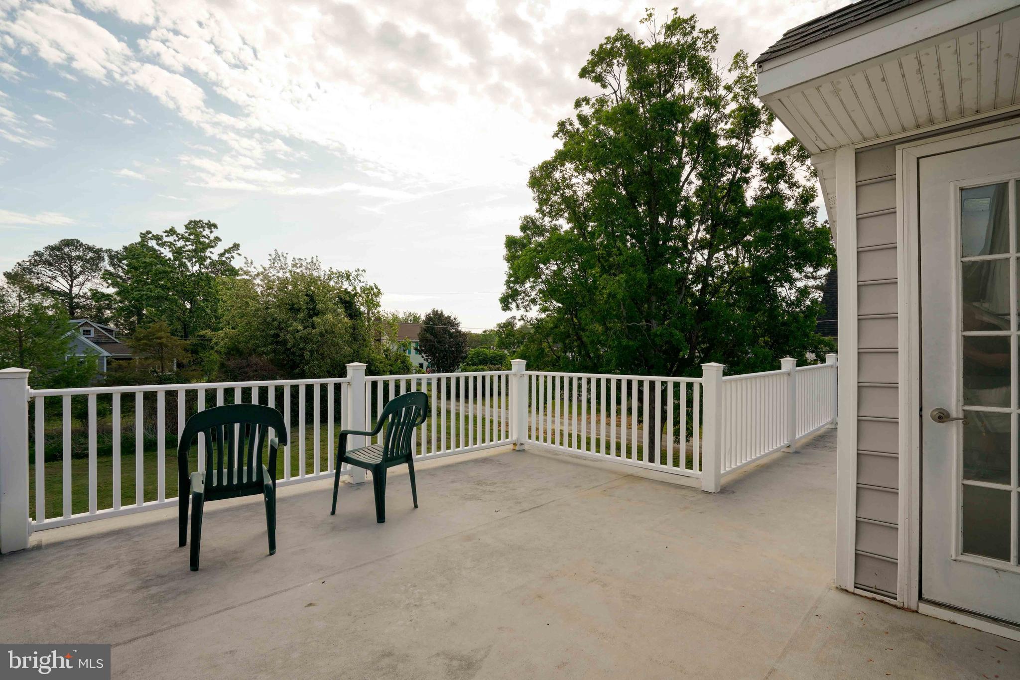 6403 Bozman Neavitt Road Neavitt, MD 21652 - Photo 25 of 31 a view of a roof deck with wooden fence and floor