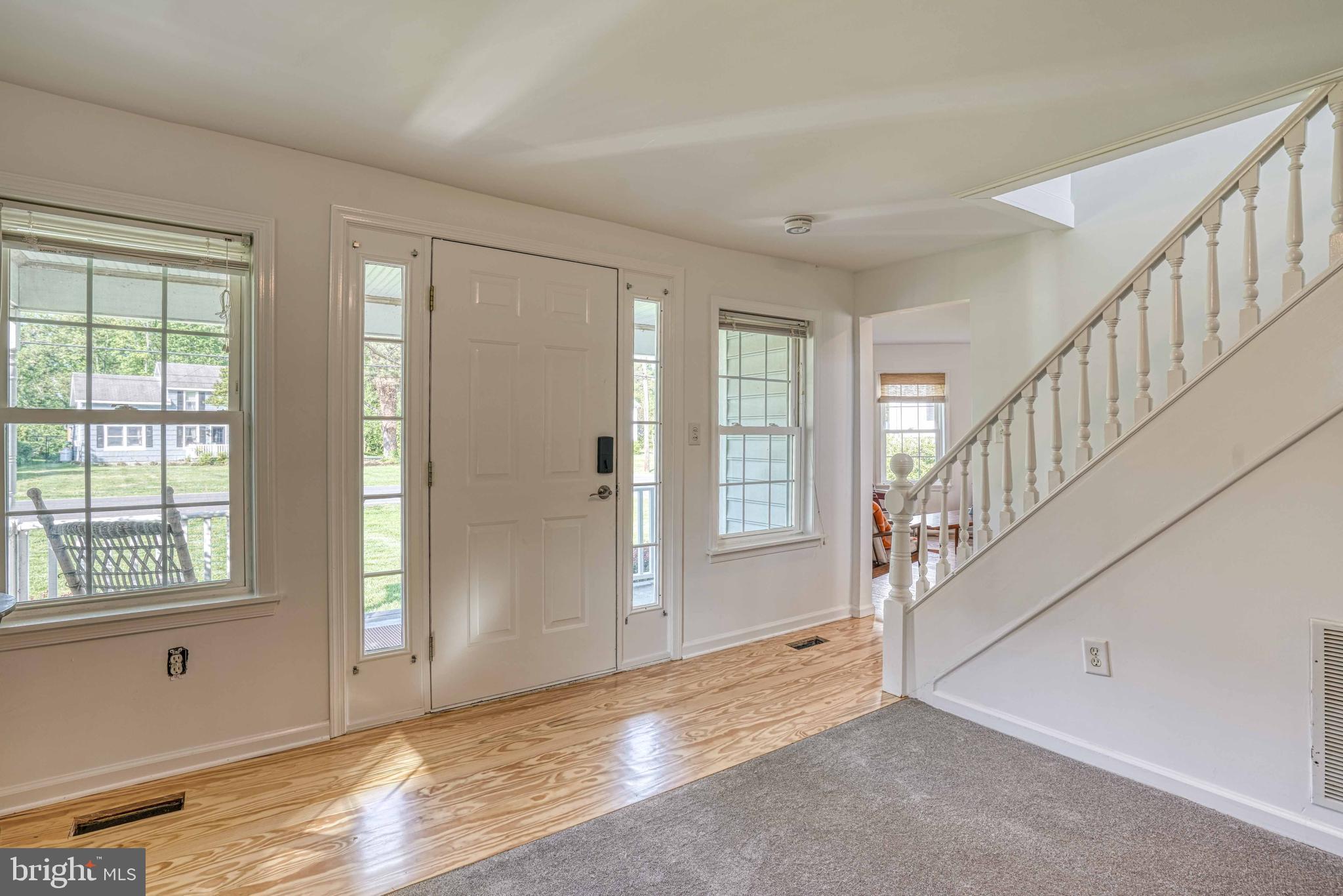 6403 Bozman Neavitt Road Neavitt, MD 21652 - Photo 3 of 31 a view of an empty room with wooden floor and windows