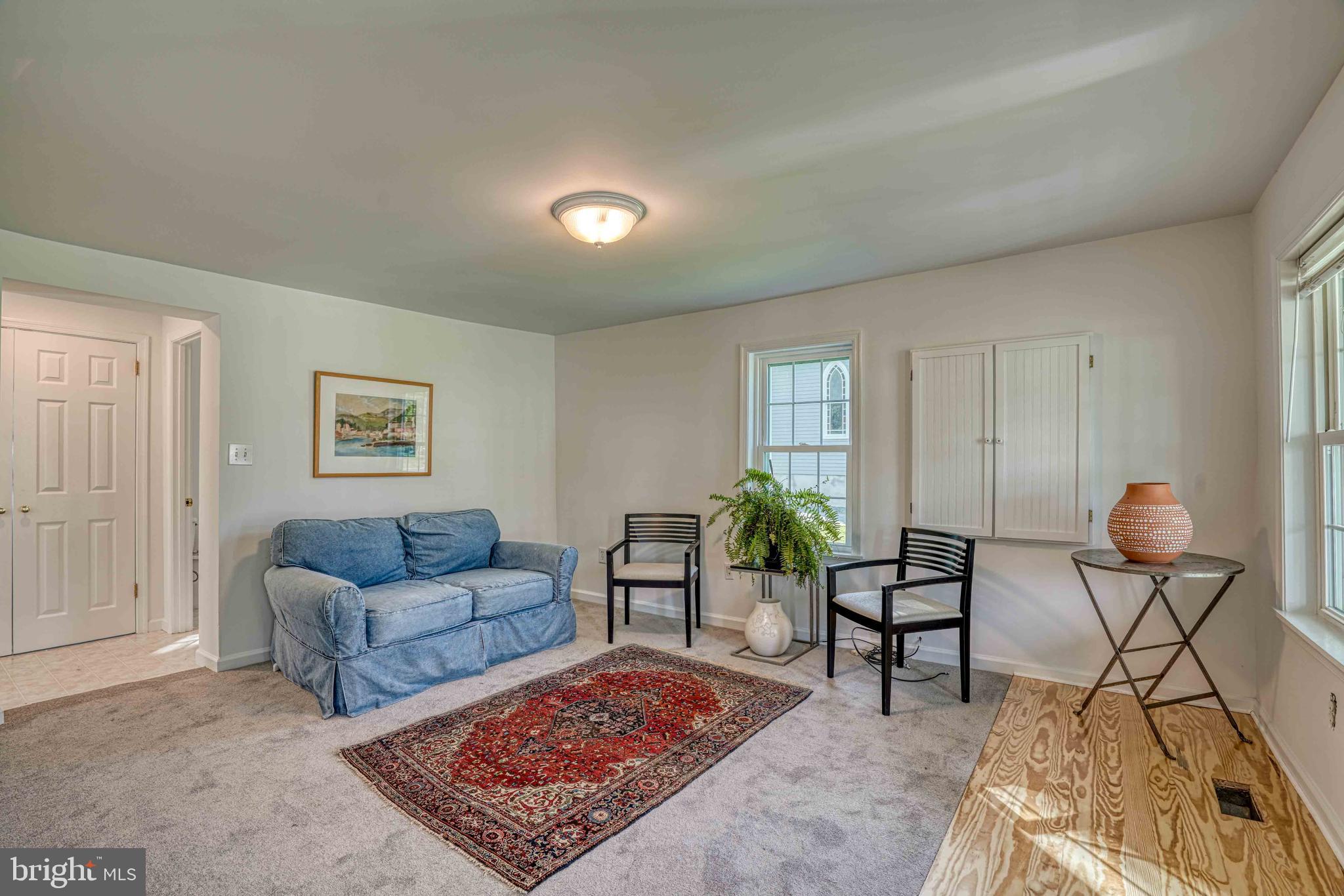6403 Bozman Neavitt Road Neavitt, MD 21652 - Photo 5 of 31 a living room with furniture and a rug