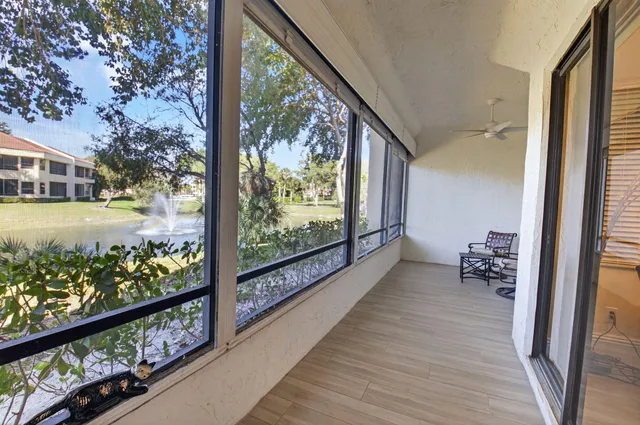 a view of a chairs and table in a balcony