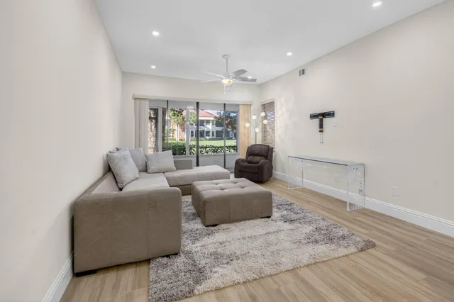 a living room with furniture and a rug