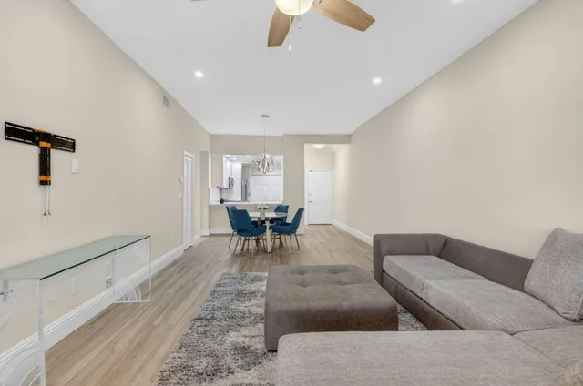 a view of a dining room with furniture and wooden floor