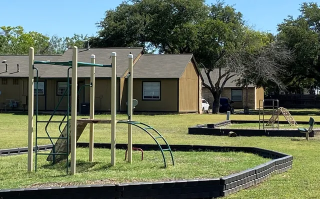 a view of a house with swimming pool and a yard