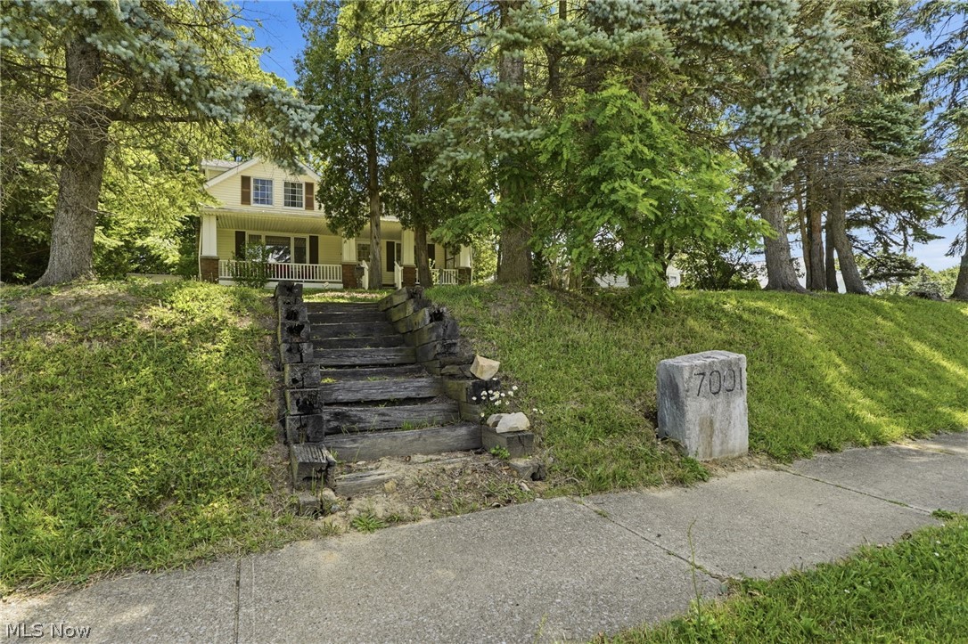 7001 State Road Parma, OH 44134 - Photo 44 of 50 before paved roads and automobiles, the address stone in this photo provided anchor for horses to be tethered