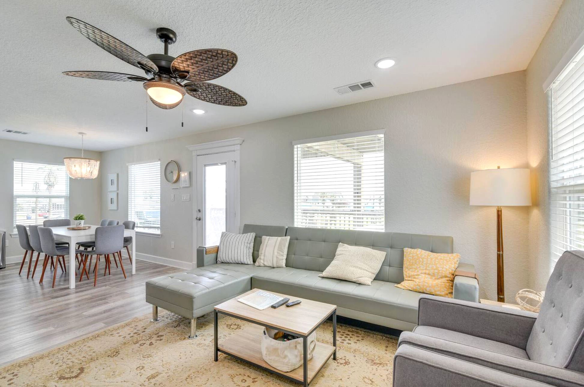 315 Murex Street Surfside Beach, TX 77541 - Photo 12 of 29 a living room with furniture a window and a chandelier