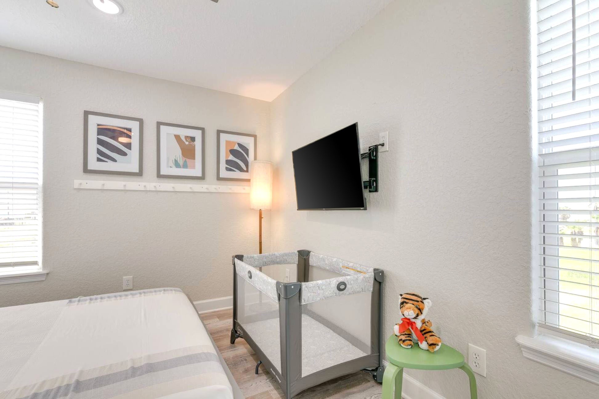 315 Murex Street Surfside Beach, TX 77541 - Photo 15 of 29 a bedroom with a bed and a flat screen tv