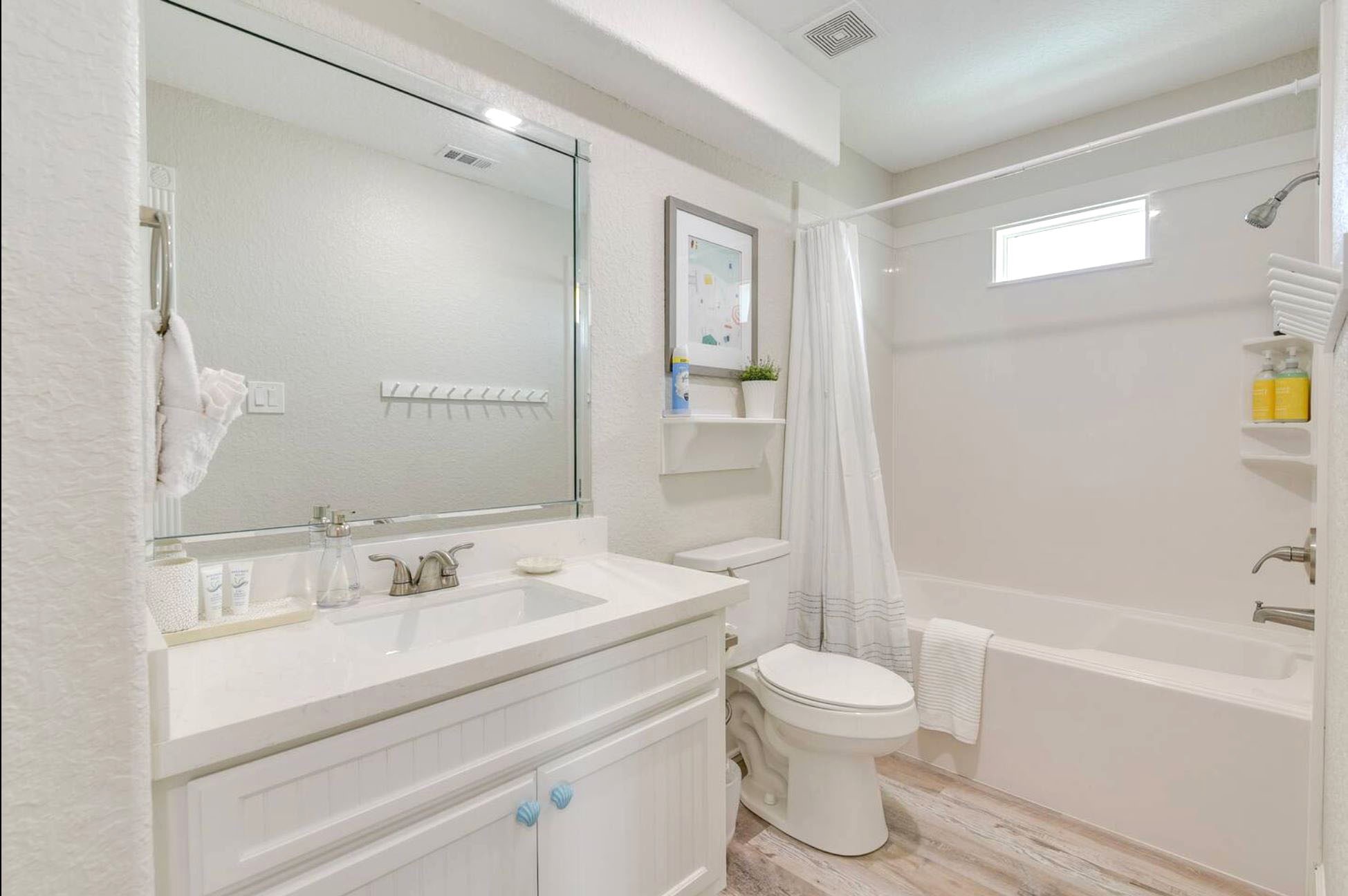 315 Murex Street Surfside Beach, TX 77541 - Photo 16 of 29 a bathroom with a sink a toilet and a bathtub