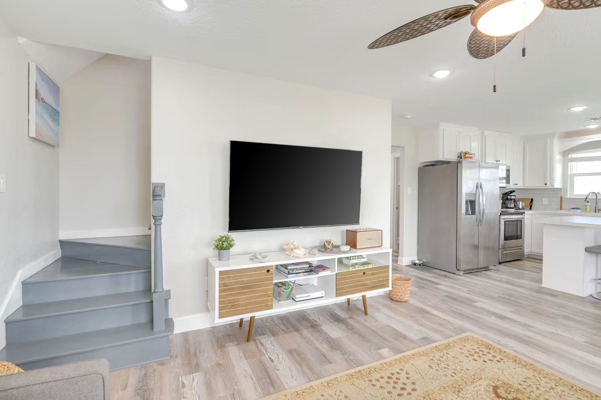 315 Murex Street Surfside Beach, TX 77541 - Photo 18 of 29 a living room with stainless steel appliances kitchen island granite countertop furniture and a flat screen tv