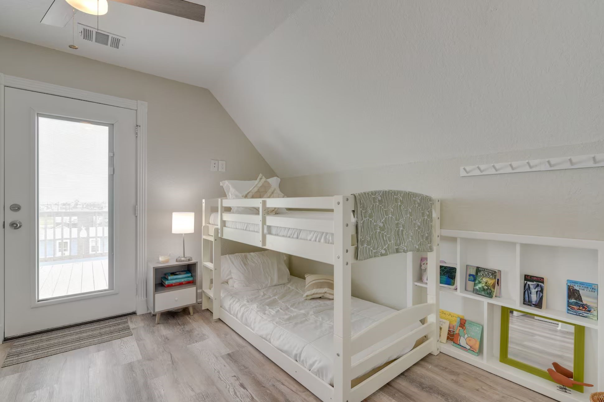 315 Murex Street Surfside Beach, TX 77541 - Photo 24 of 29 a bedroom with furniture and a fireplace