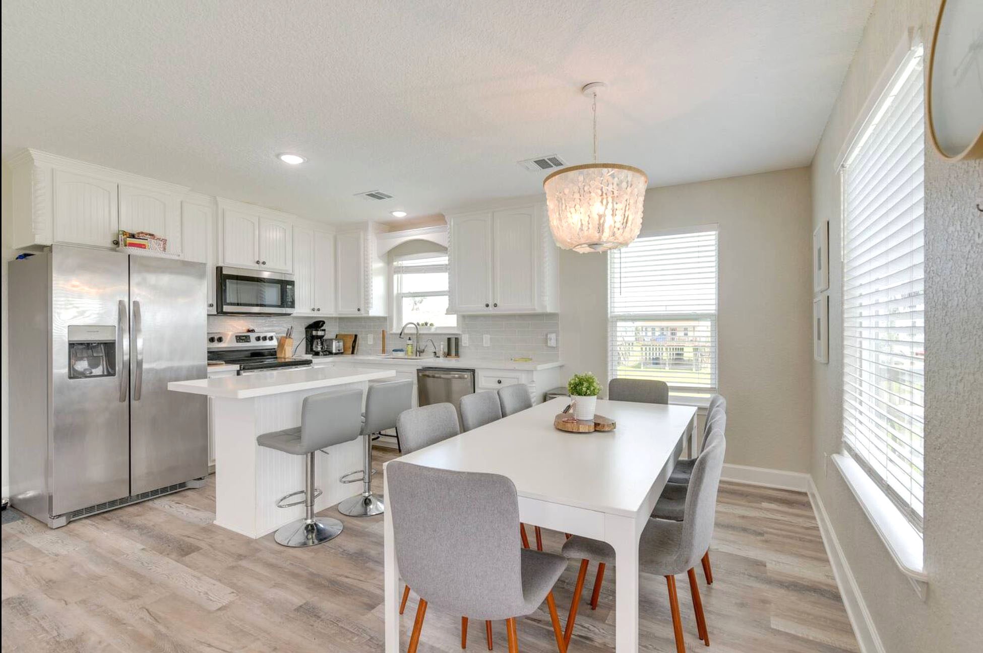 315 Murex Street Surfside Beach, TX 77541 - Photo 5 of 29 a view of kitchen with refrigerator dining table and chairs
