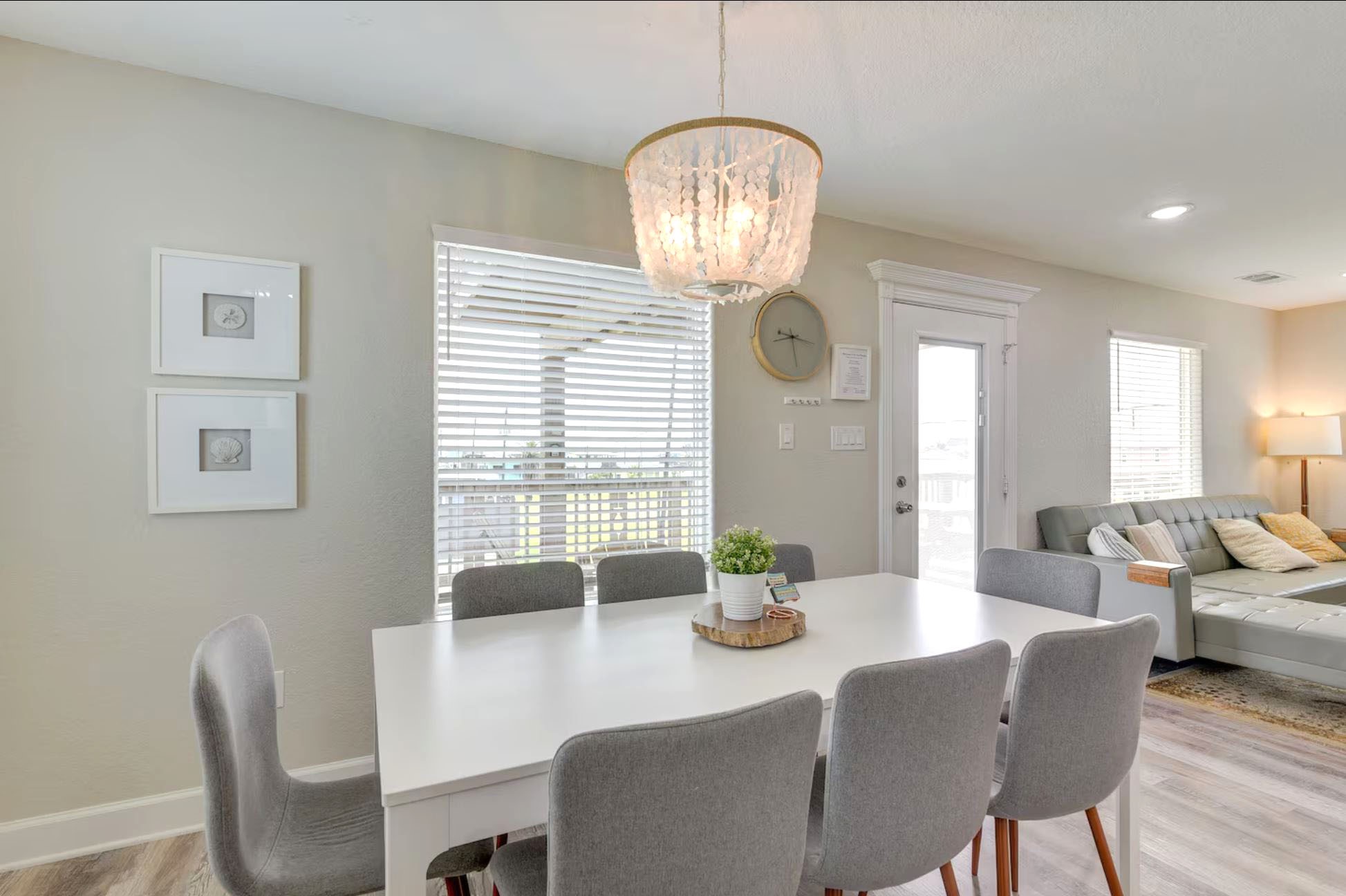 315 Murex Street Surfside Beach, TX 77541 - Photo 7 of 29 a view of a dining room with furniture a chandelier and wooden floor