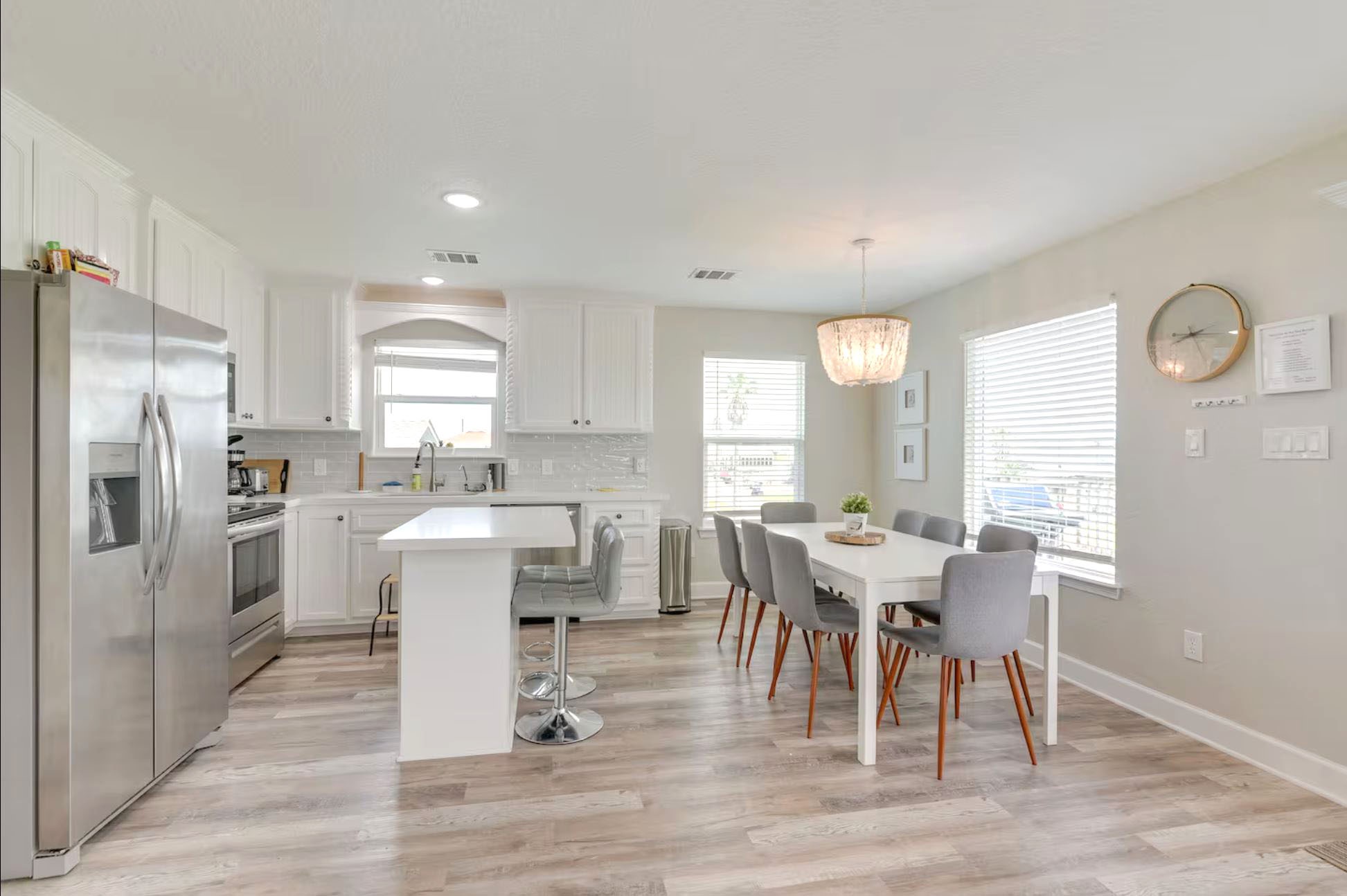 315 Murex Street Surfside Beach, TX 77541 - Photo 9 of 29 a view of a dining room with furniture window and wooden floor