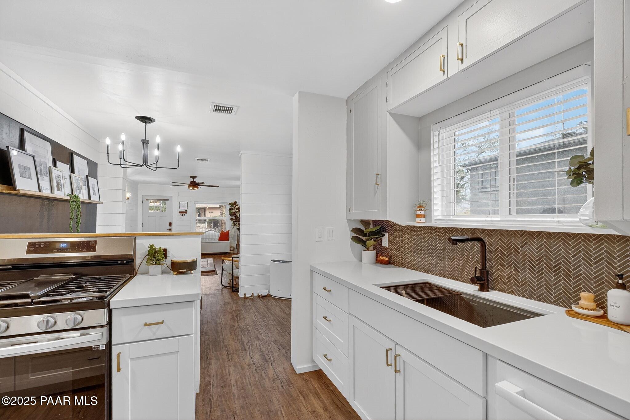 730 4th Street Prescott, AZ 86301 - Photo 12 of 37 a kitchen that has a sink and a stove