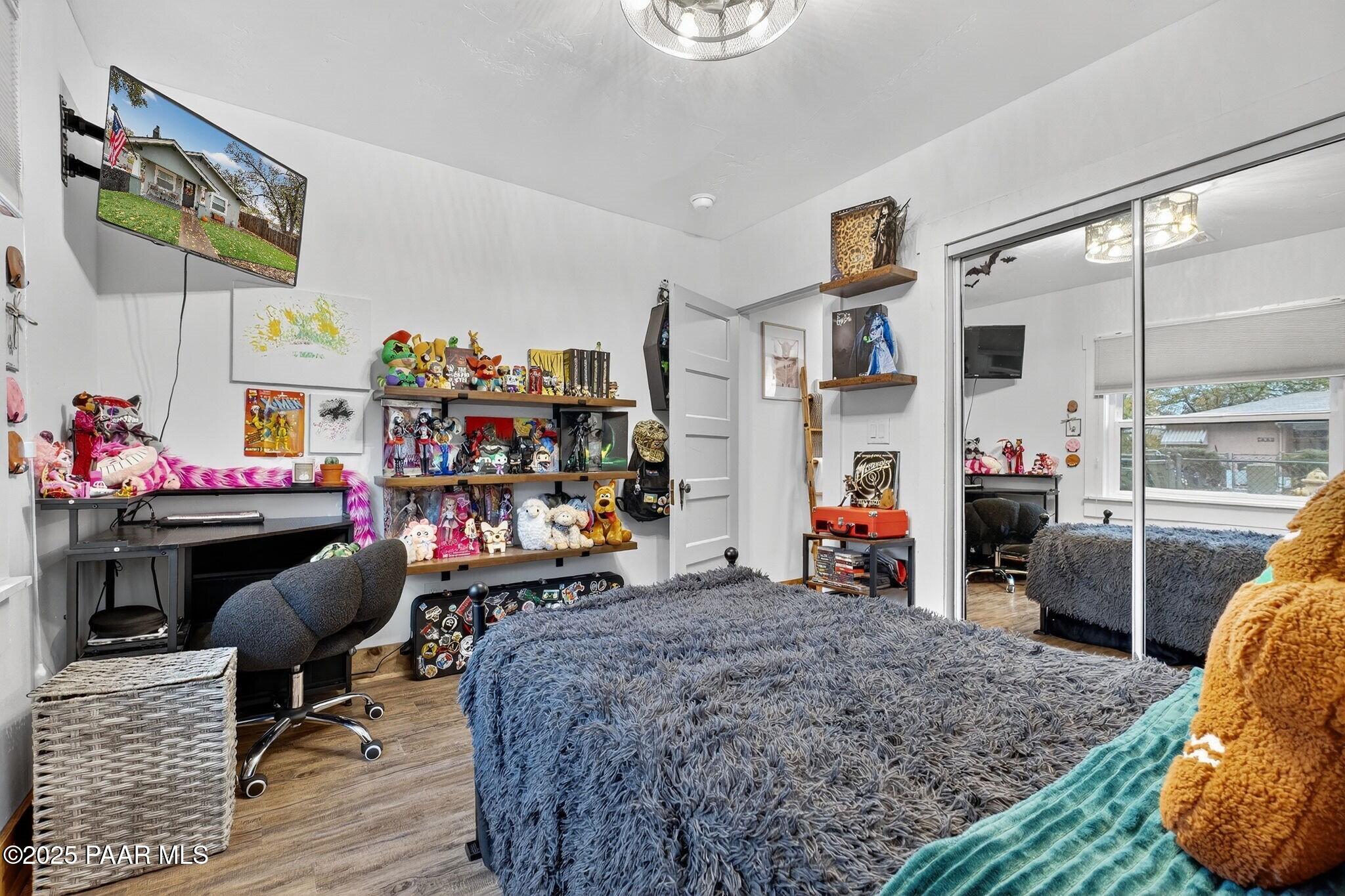 730 4th Street Prescott, AZ 86301 - Photo 22 of 37 a bed room with a bed and a chair