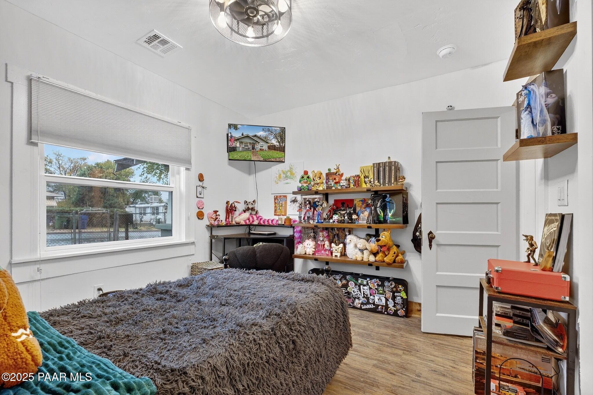 730 4th Street Prescott, AZ 86301 - Photo 23 of 37 a bed room with a bed and a chair