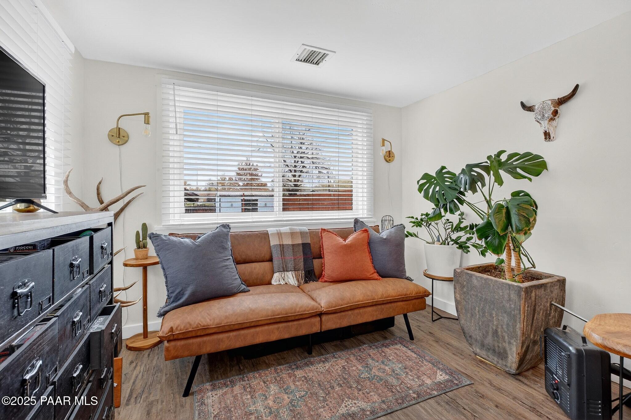730 4th Street Prescott, AZ 86301 - Photo 27 of 37 a living room with furniture a window and a potted plant