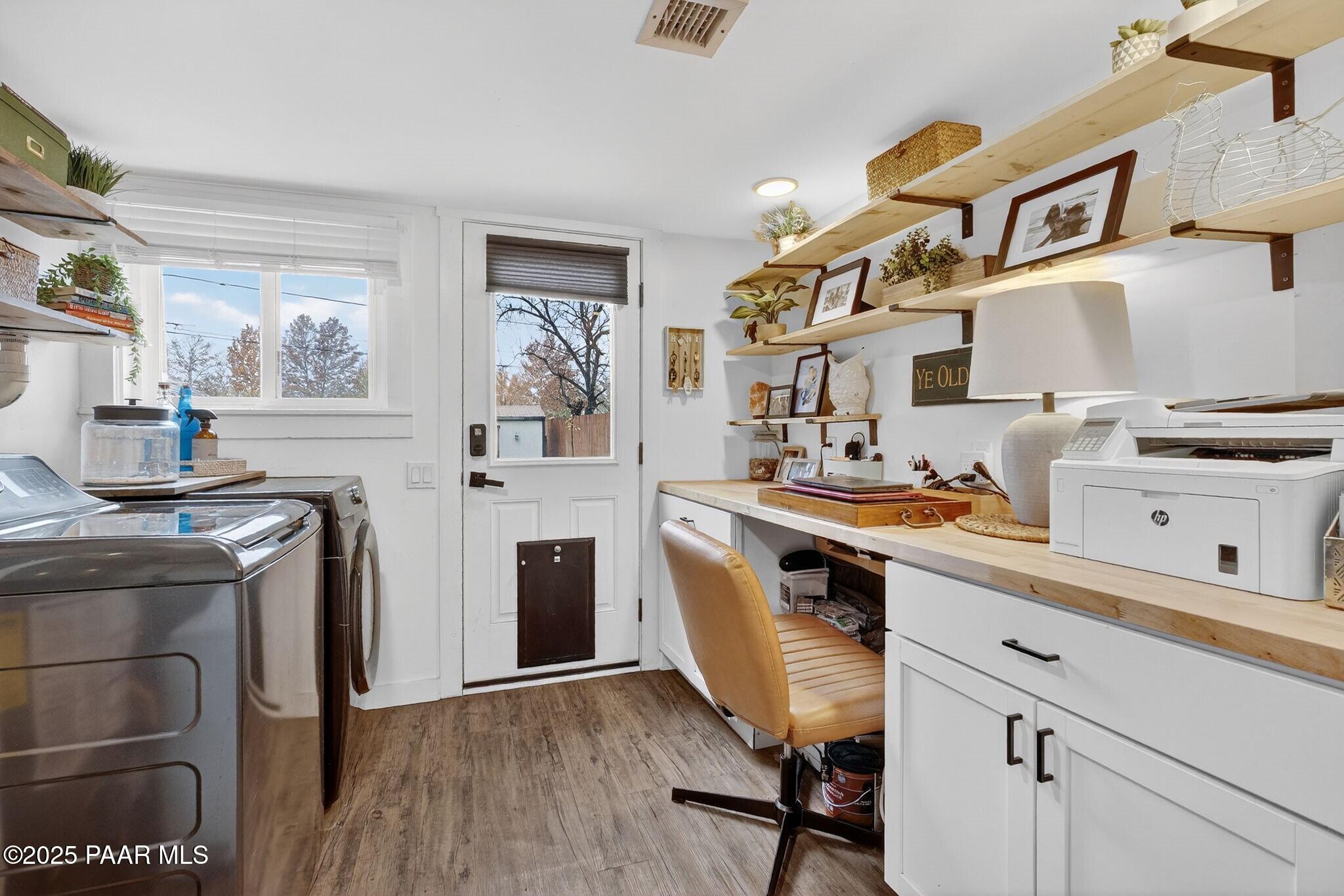 730 4th Street Prescott, AZ 86301 - Photo 28 of 37 a kitchen with cabinets and wooden floor