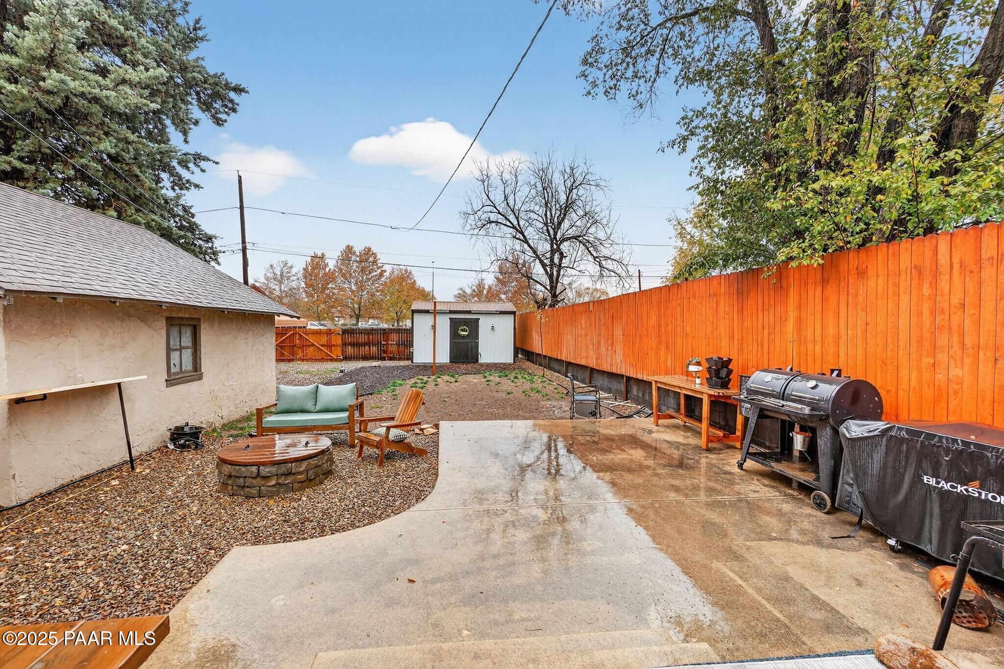 730 4th Street Prescott, AZ 86301 - Photo 30 of 37 a backyard of a house with table and chairs