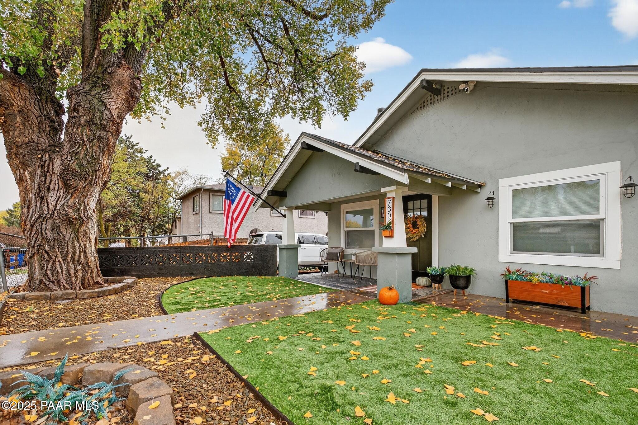 730 4th Street Prescott, AZ 86301 - Photo 3 of 37 a front view of a house with garden