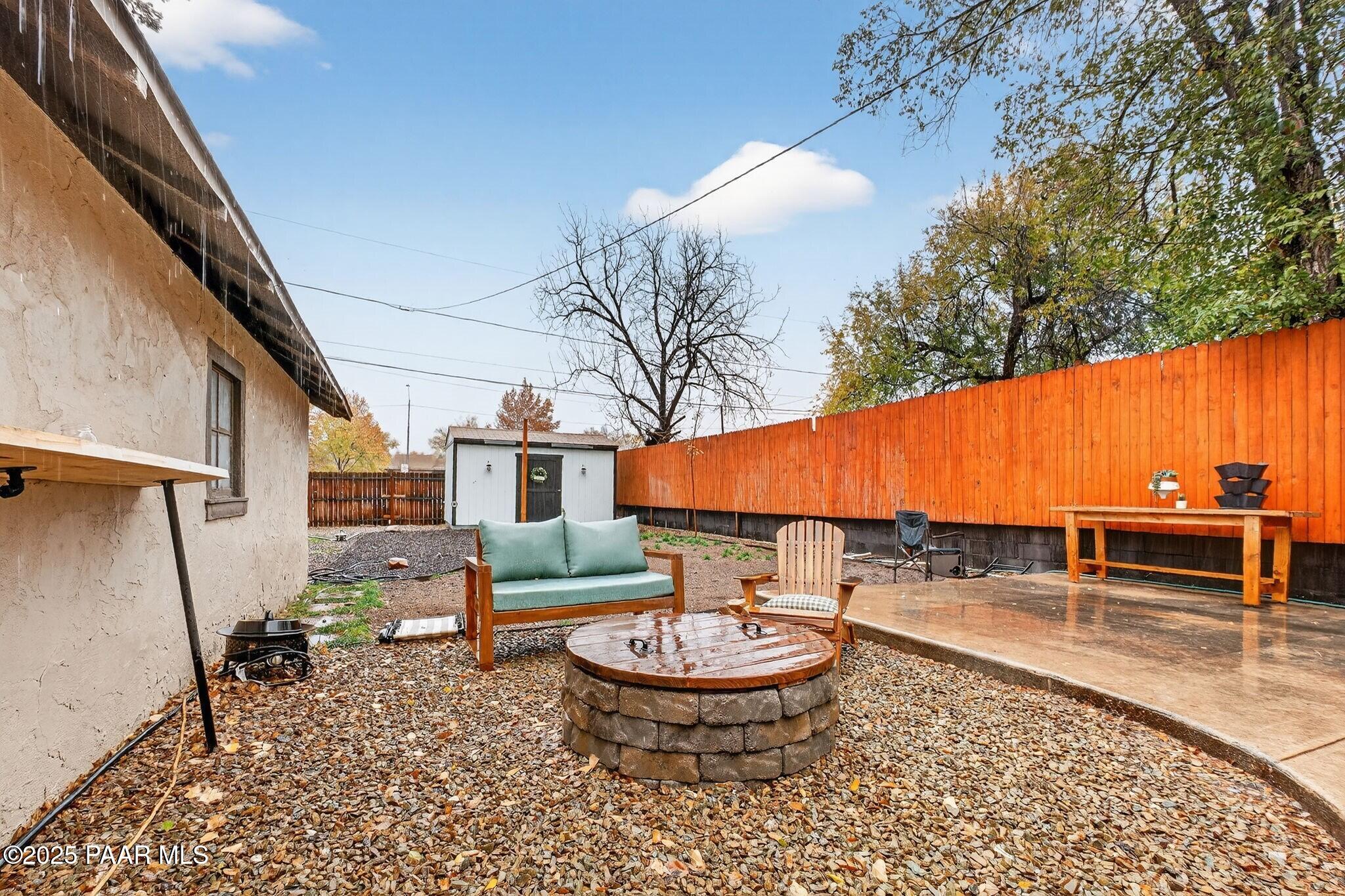 730 4th Street Prescott, AZ 86301 - Photo 31 of 37 a backyard of a house with table and chairs