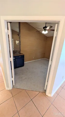 a room with a sink and a mirror