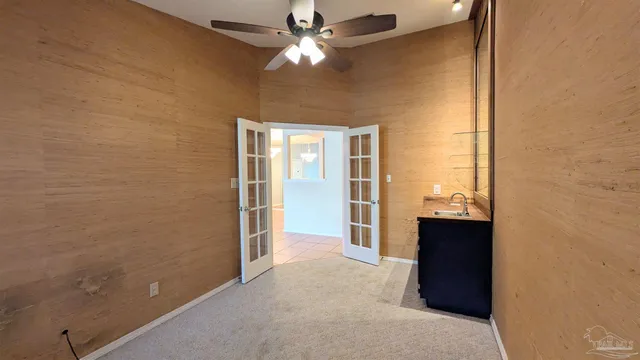 a room with window and ceiling fan