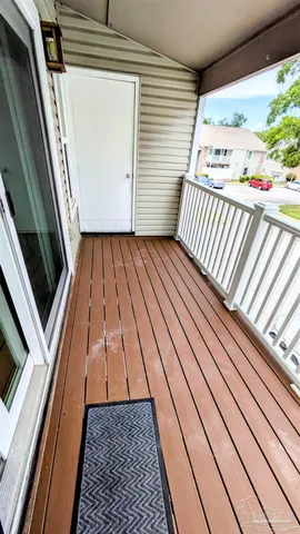 a view of a house with pool porch and chairs