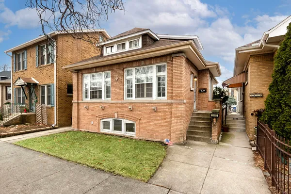 front view of a house with a yard