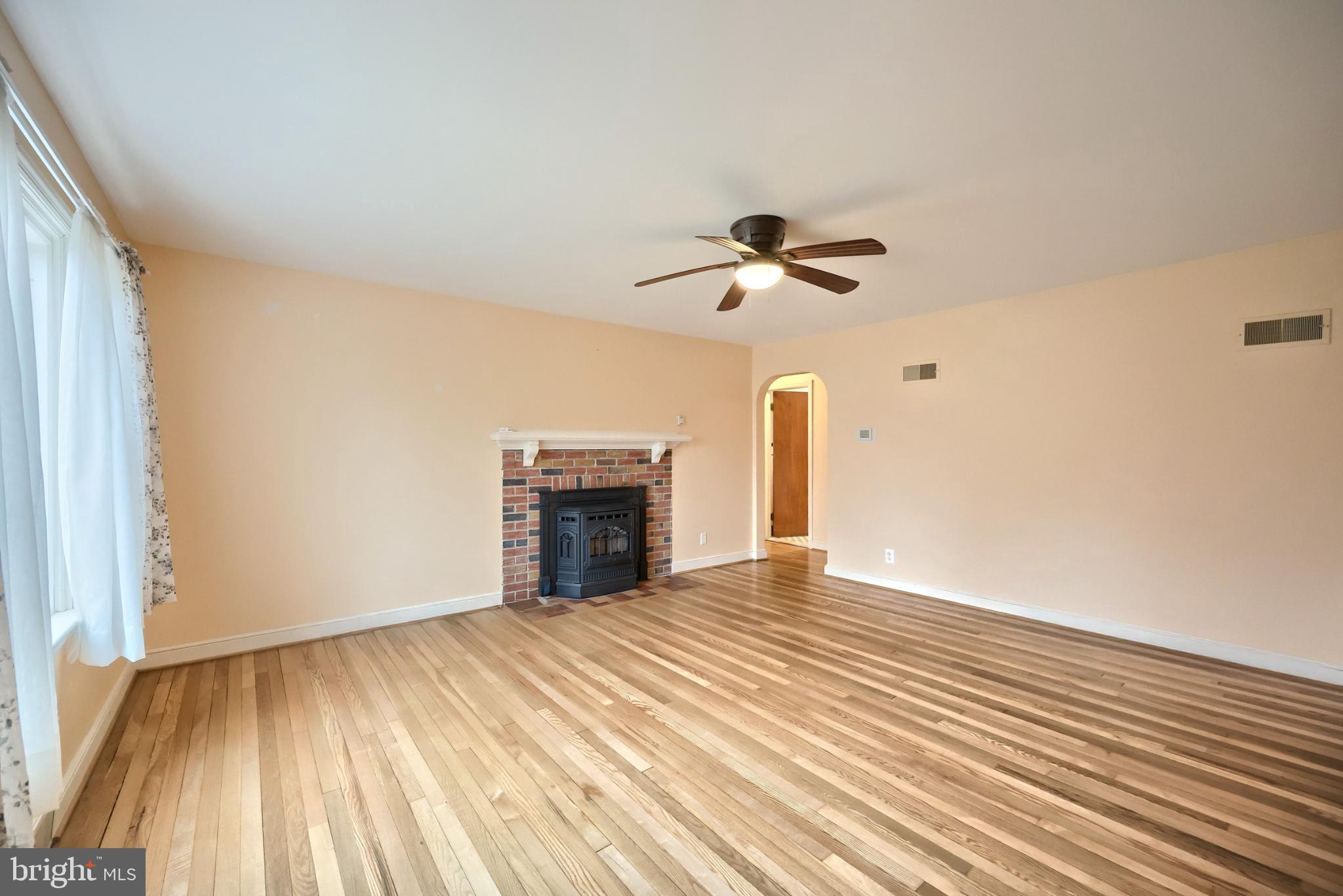 301 North Forrest Street York, PA 17404 - Photo 8 of 42 Spacious living room with warm wooden floors.