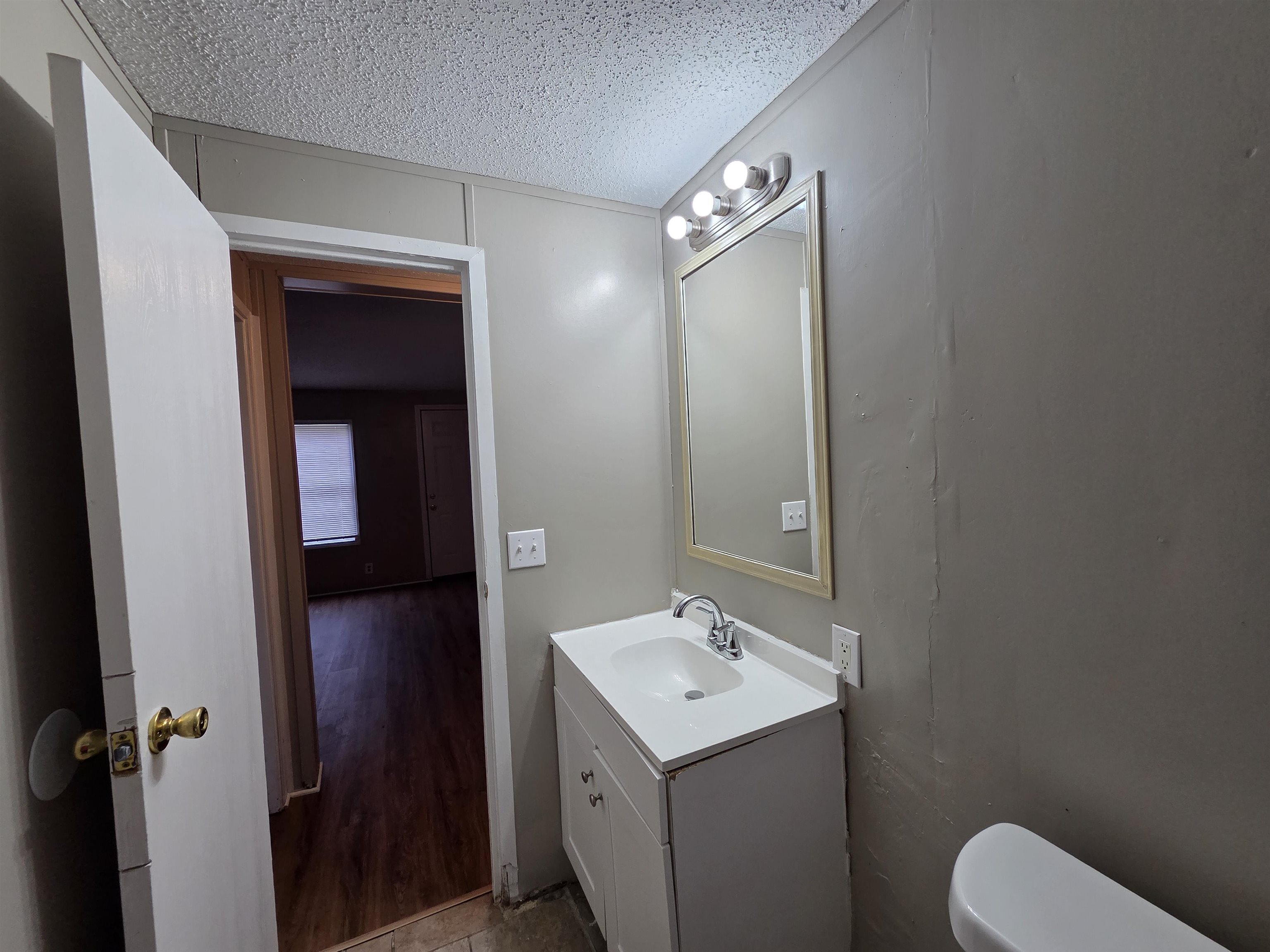 2956 Lake Park Road Memphis, TN 38127 - Photo 24 of 25 a bathroom with a toilet sink and mirror