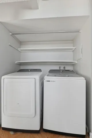 a utility room with washer and dryer