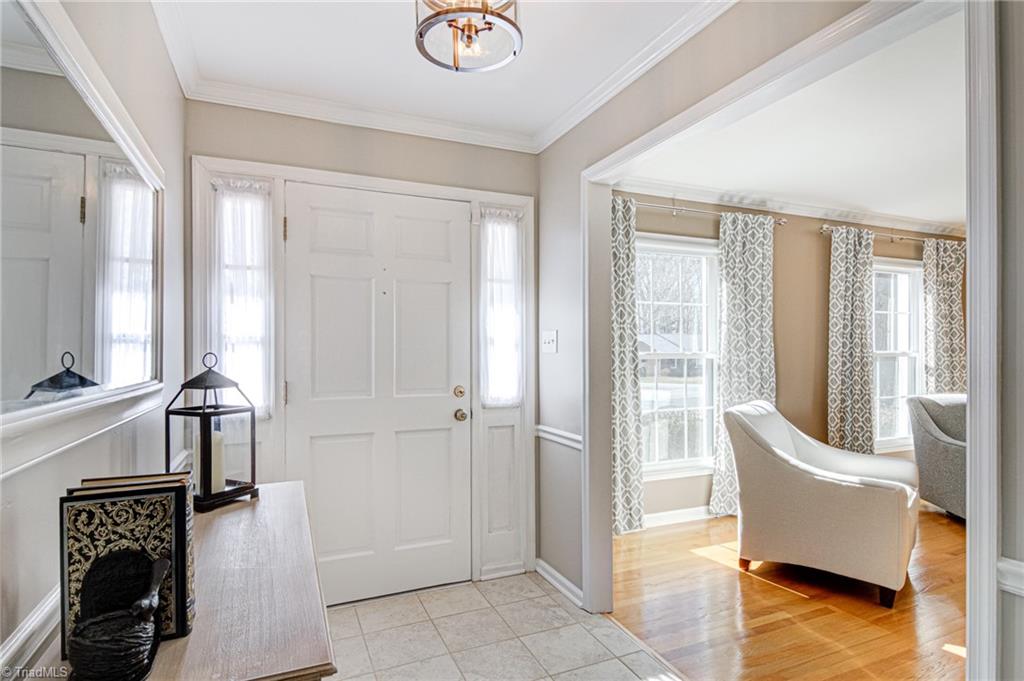 4516 Tower Road Greensboro, NC 27410 - Photo 2 of 26 Tiled foyer entry opens to Living Room