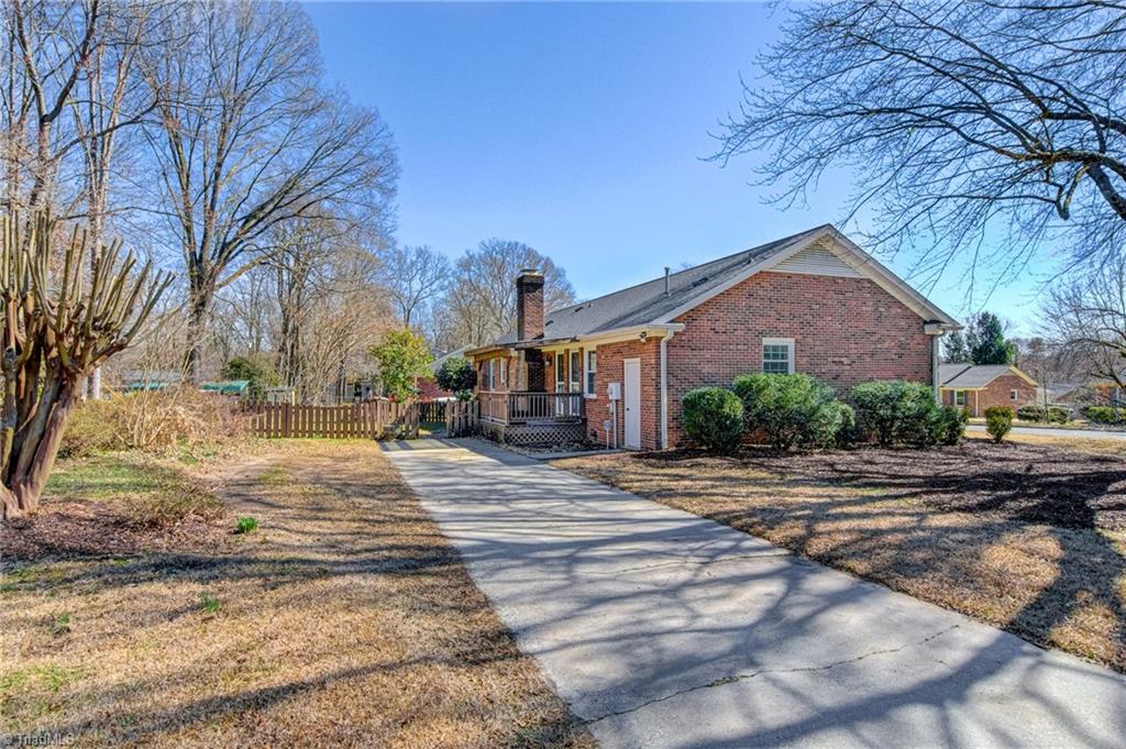 4516 Tower Road Greensboro, NC 27410 - Photo 26 of 26 Driveway is tucked in on the side - an added convenience of a corner lot