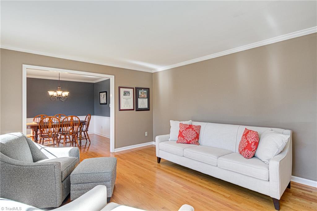 4516 Tower Road Greensboro, NC 27410 - Photo 5 of 26 Oversized openings between Living and Dining rooms provides easy flow