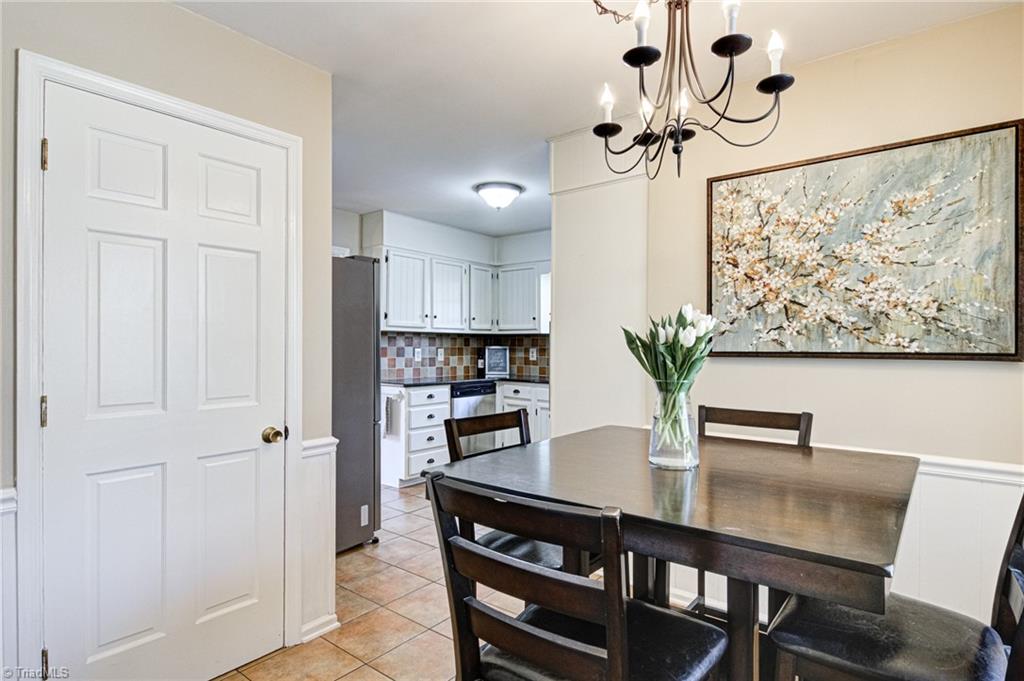 4516 Tower Road Greensboro, NC 27410 - Photo 10 of 26 Kitchen features separate eat-in casual dining area and private laundry/storage