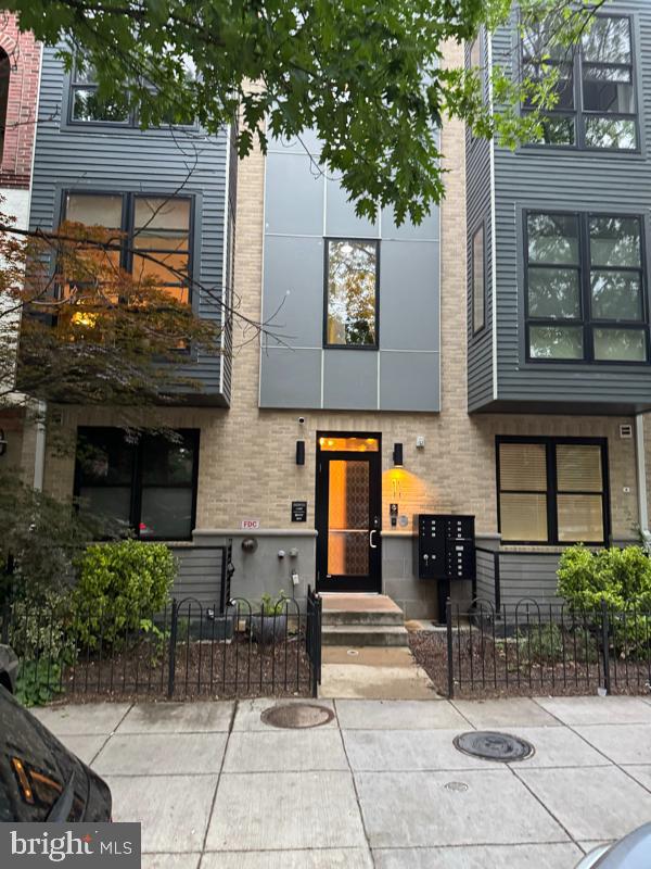 a building with potted plants in front of it