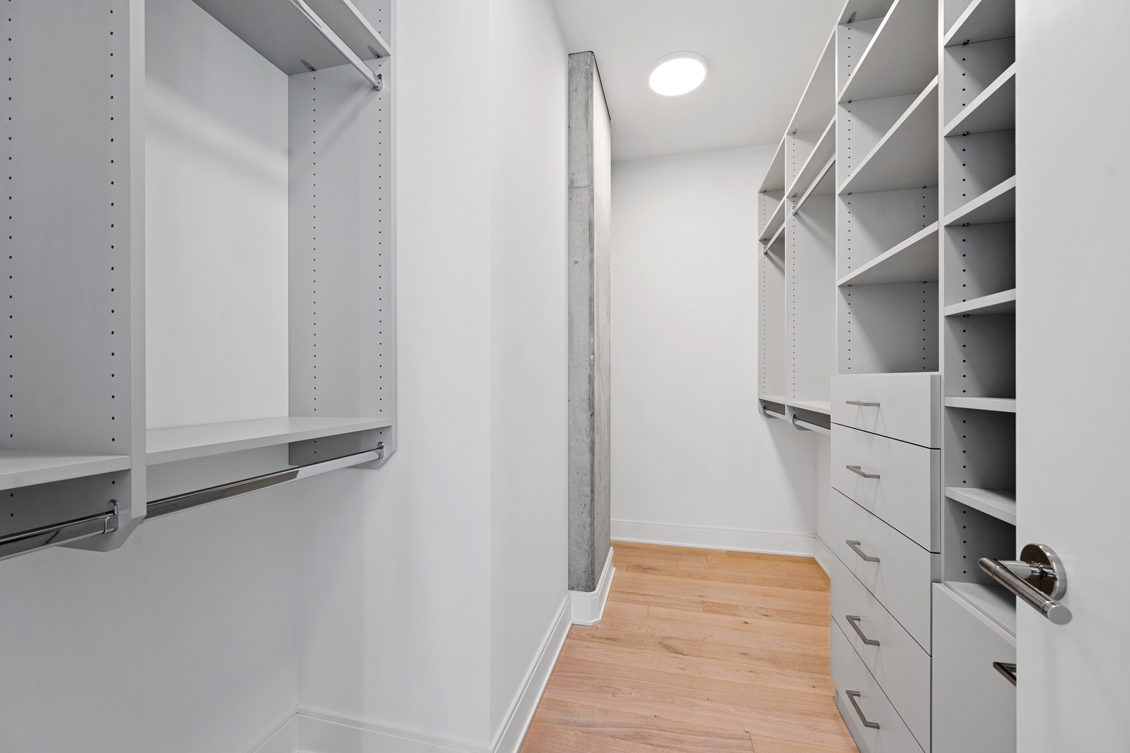 60 East Randolph Street, Unit 20D Chicago, IL 60601 - Photo 11 of 24 a view of walk in closet with empty racks