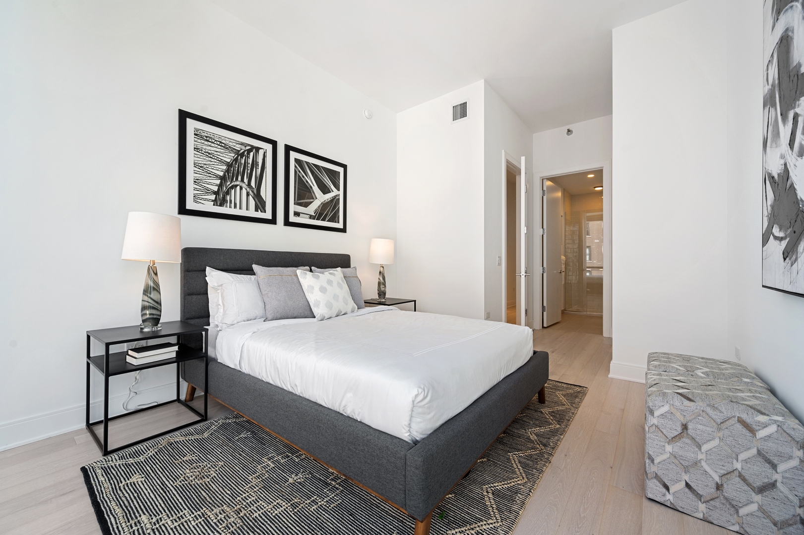 60 East Randolph Street, Unit 20D Chicago, IL 60601 - Photo 13 of 24 a bedroom with bed and cupboard