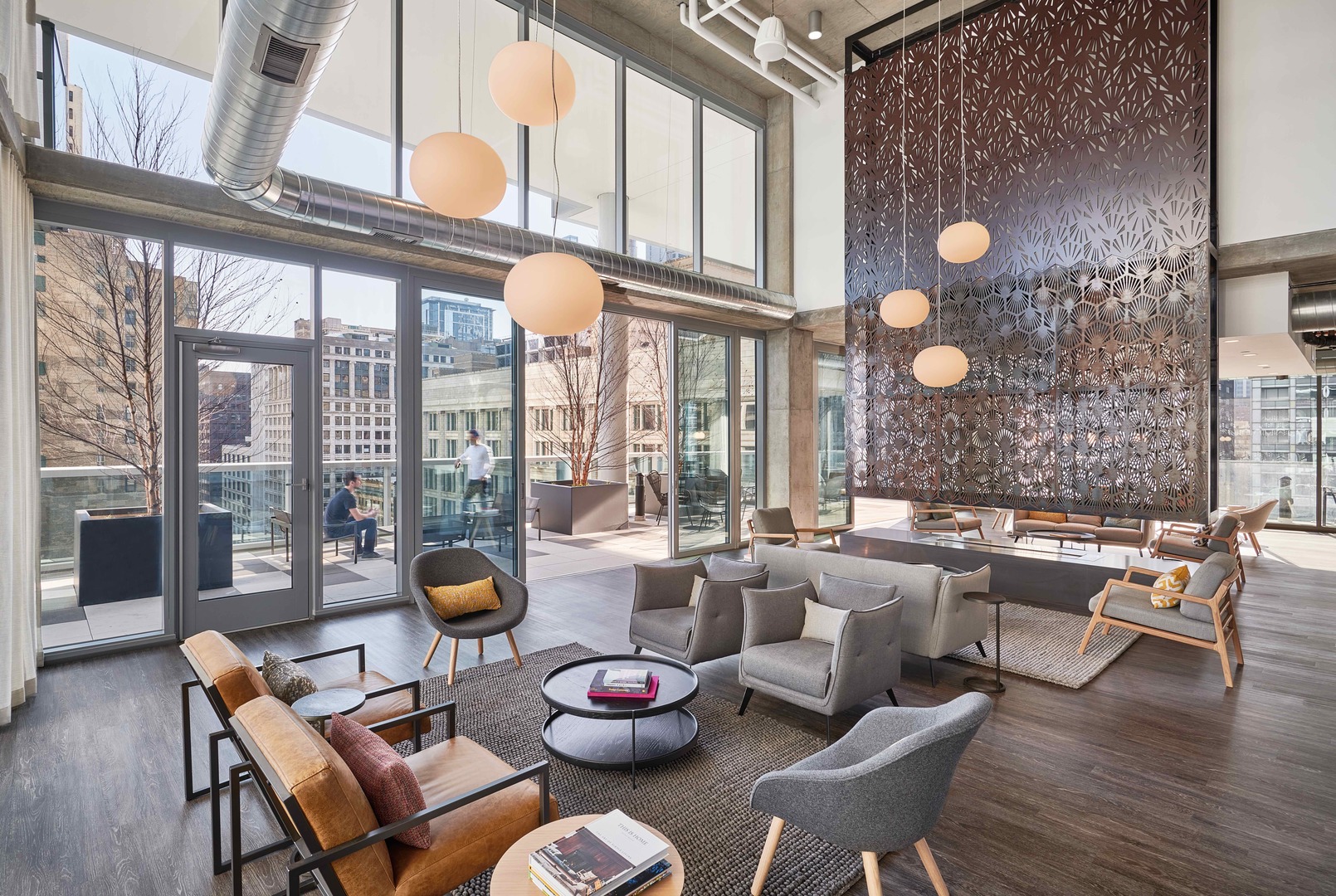 60 East Randolph Street, Unit 20D Chicago, IL 60601 - Photo 17 of 24 a living room with furniture and a floor to ceiling window