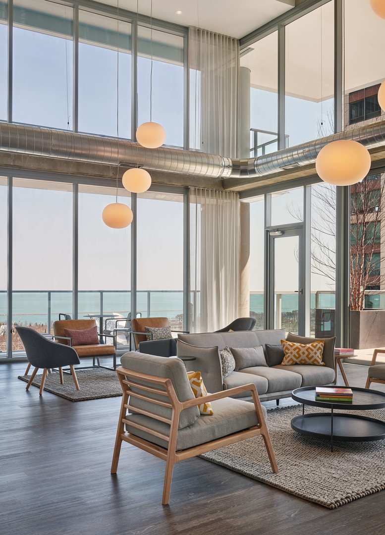 60 East Randolph Street, Unit 20D Chicago, IL 60601 - Photo 18 of 24 a living room with furniture and a large window