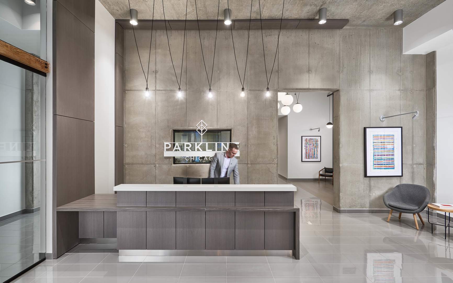 60 East Randolph Street, Unit 20D Chicago, IL 60601 - Photo 2 of 24 a living room with furniture and a potted plant