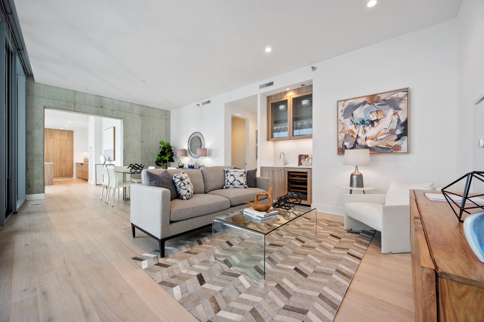 60 East Randolph Street, Unit 20D Chicago, IL 60601 - Photo 3 of 24 a living room with furniture and a fireplace