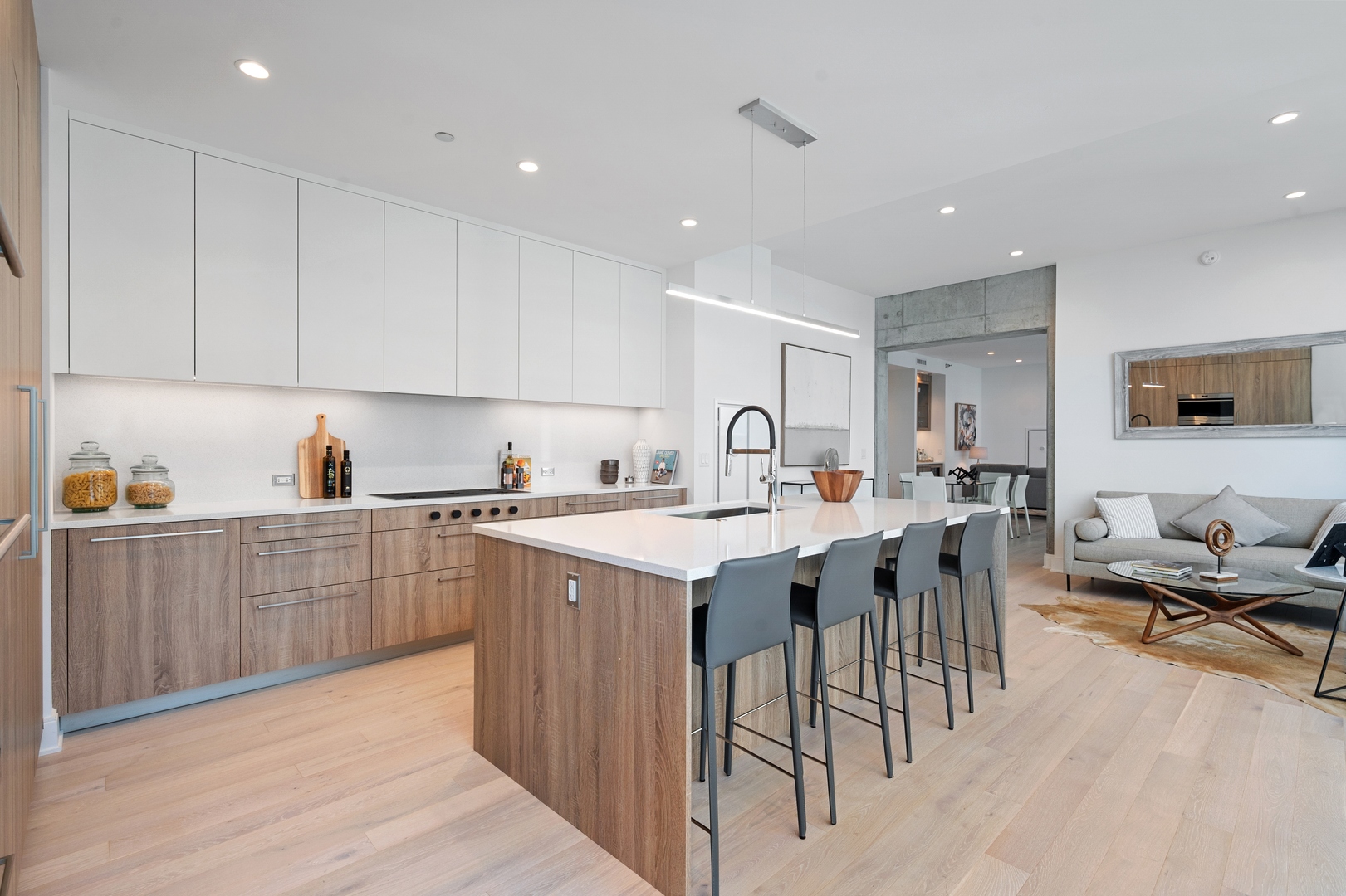 60 East Randolph Street, Unit 20D Chicago, IL 60601 - Photo 6 of 24 a kitchen with a sink a stove and cabinets