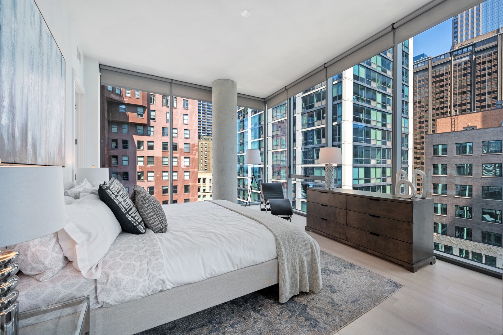 60 East Randolph Street, Unit 20D Chicago, IL 60601 - Photo 8 of 24 a bedroom with a bed and a large window